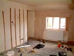 Bedroom with plaster going back on